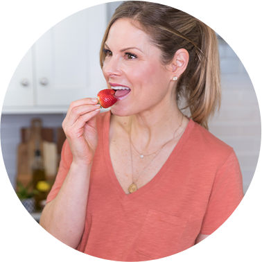 Weight loss coach Dani Spies enjoys a strawberry